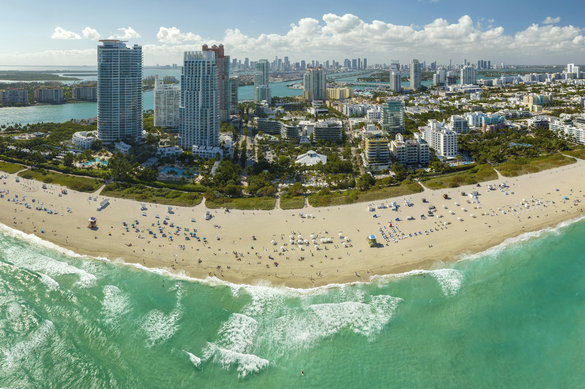 Miami Beach city with high luxury hotels and condos and sandy beachfront.